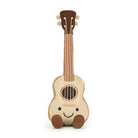 A plush toy ukulele with a smiling face, primarily beige in color with a brown headstock and bridge, and a happy facial expression.