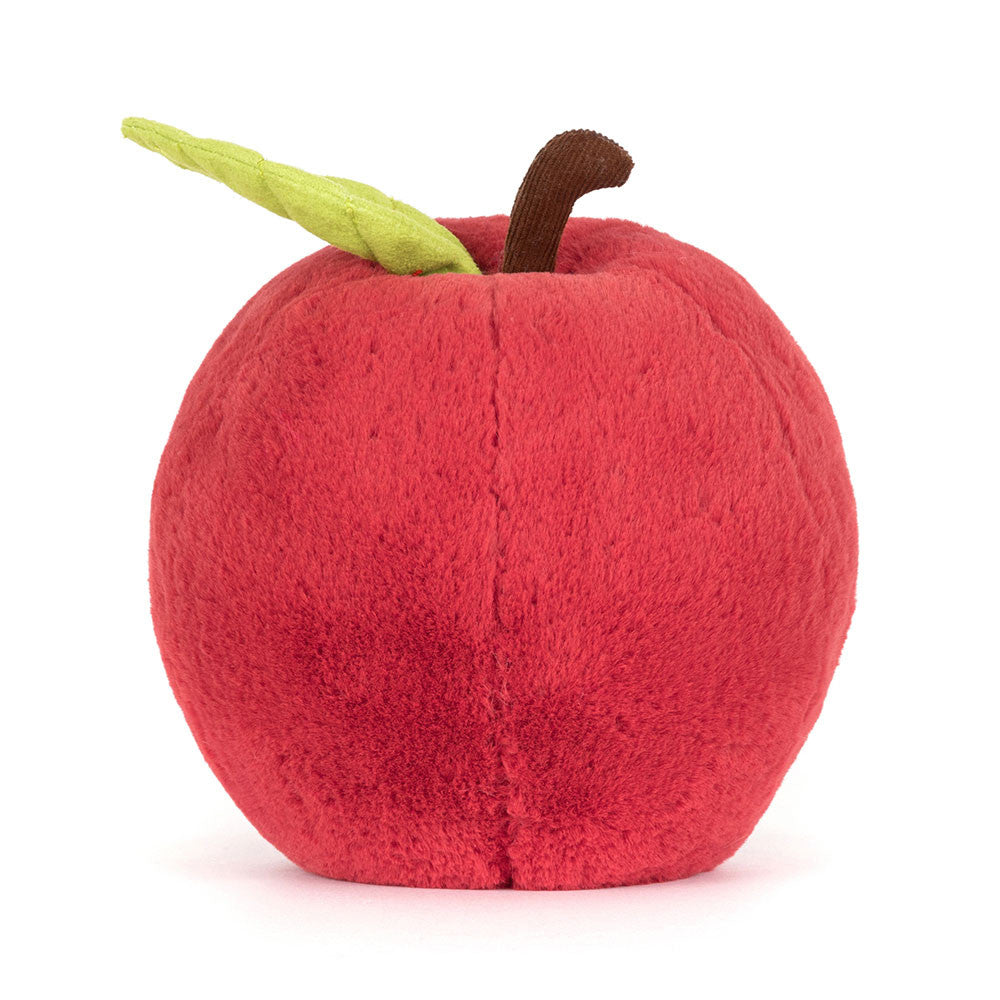 Plush toy shaped like a red apple with a green leaf and brown stem on a white background