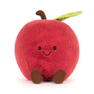 Plush toy shaped like a red apple with a smiling face on a white background