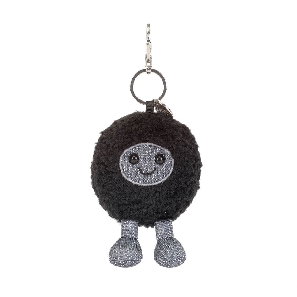 Black plush keychain with a smiling face on a white background