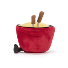 Plush toy resembling a red bowl with yellow contents and brown sticks on a white background