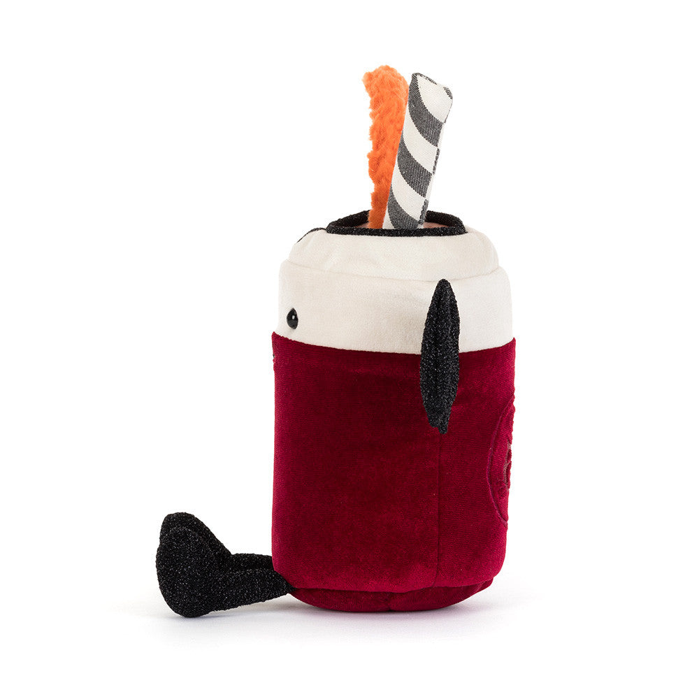 A plush toy shaped like a hot chocolate cup, featuring a deep red body, a cream-colored top, a black handle, and a black-and-white striped straw with an orange loop, shown on a plain white background.