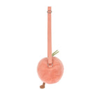Pink plush ball with a strap on a white background