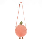 Plush peach-shaped bag with a strap on a white background