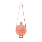 Plush peach-shaped bag with a strap on a white background