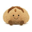 Plush toy resembling a loaf of bread with a smiling face on a white background