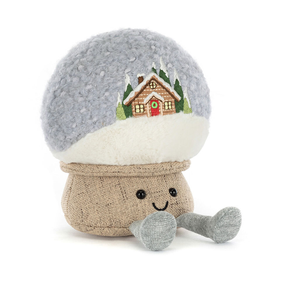 Stuffed mushroom toy with a snow globe top featuring a cabin scene on a white background