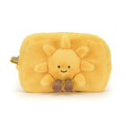 Yellow plush sun-shaped pouch with a smiling face on a white background