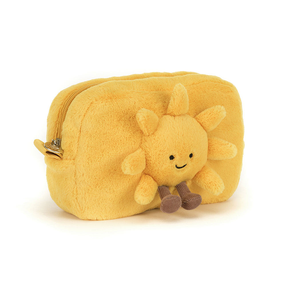 Yellow plush sun-shaped pouch with a smiling sun face on a white background