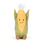 Plush toy resembling a corn on the cob with a smiling face on a white background