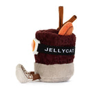 A plush toy shaped like a coffee cup with the brand name 'JELLYCAT' on a black band, featuring a dark burgundy top, beige bottom, brown handle, and orange and white details, photographed on a white background.