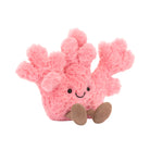 A plush toy resembling a pink coral with a smiling face and brown eyes, designed for young children.