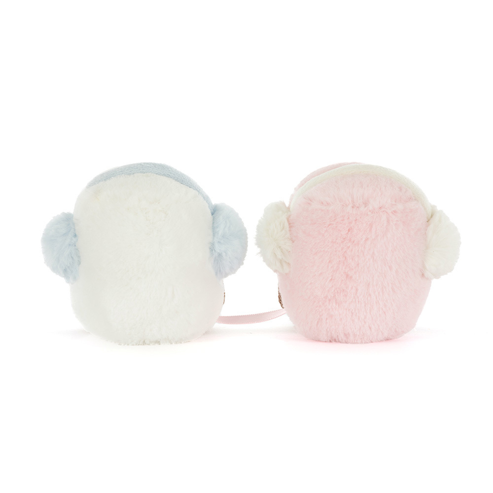 Pair of pastel-colored earmuffs on a white background
