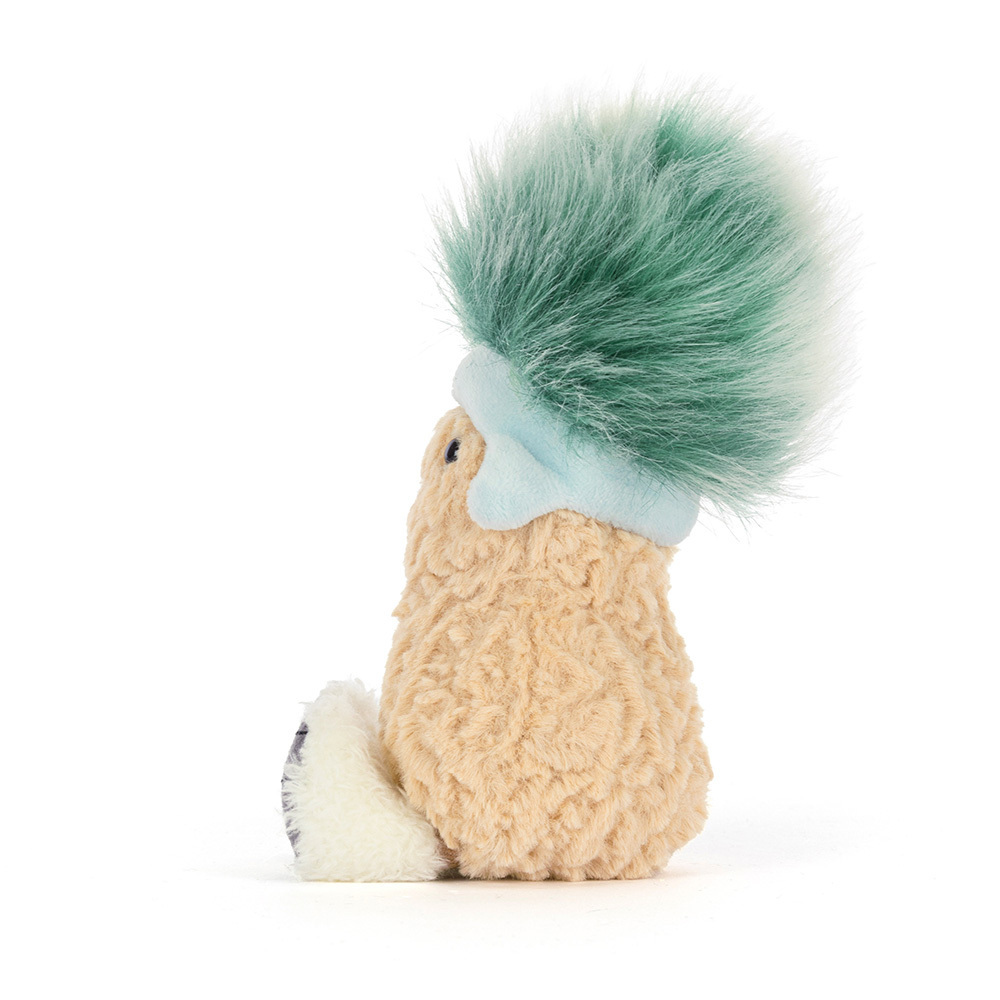 Plush toy resembling a squirrel with a green tuft of hair on a white background