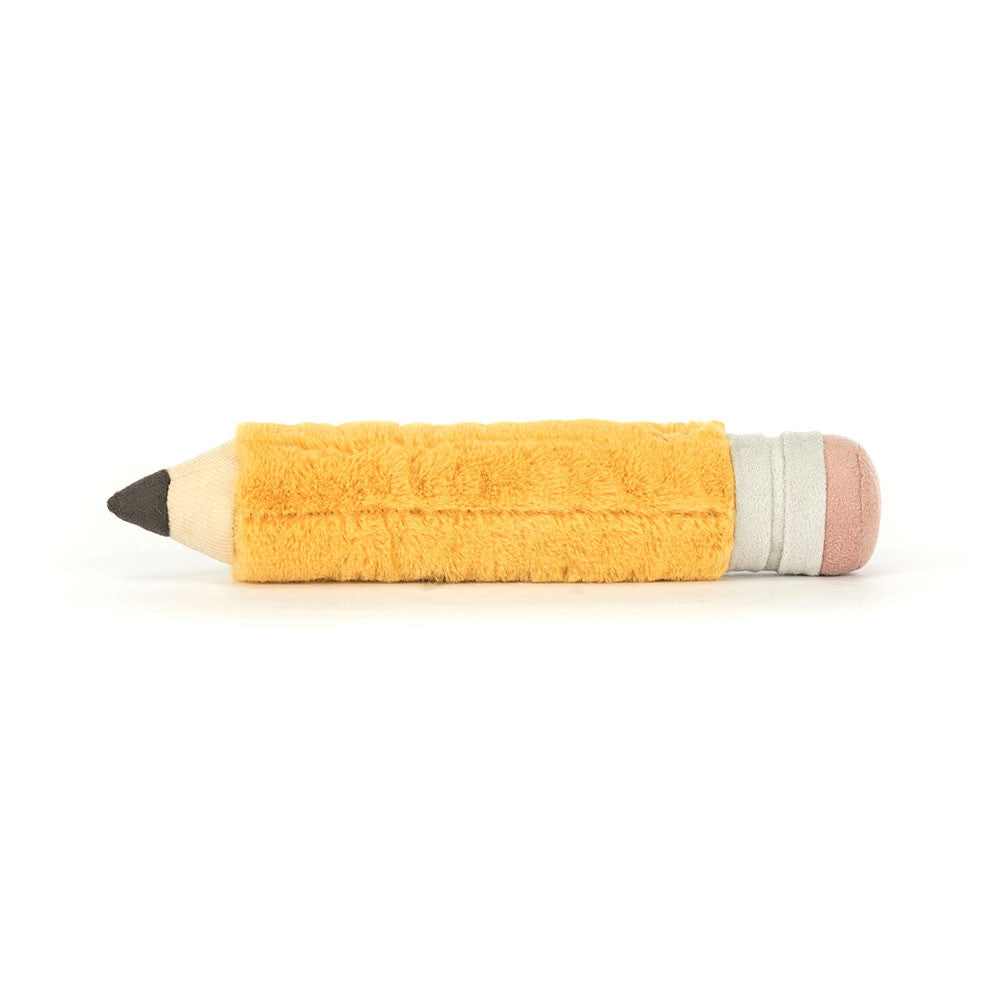 Toy pencil with a yellow body, gray eraser, and pink rubber on a white background