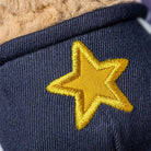 Navy blue fabric with a yellow embroidered star