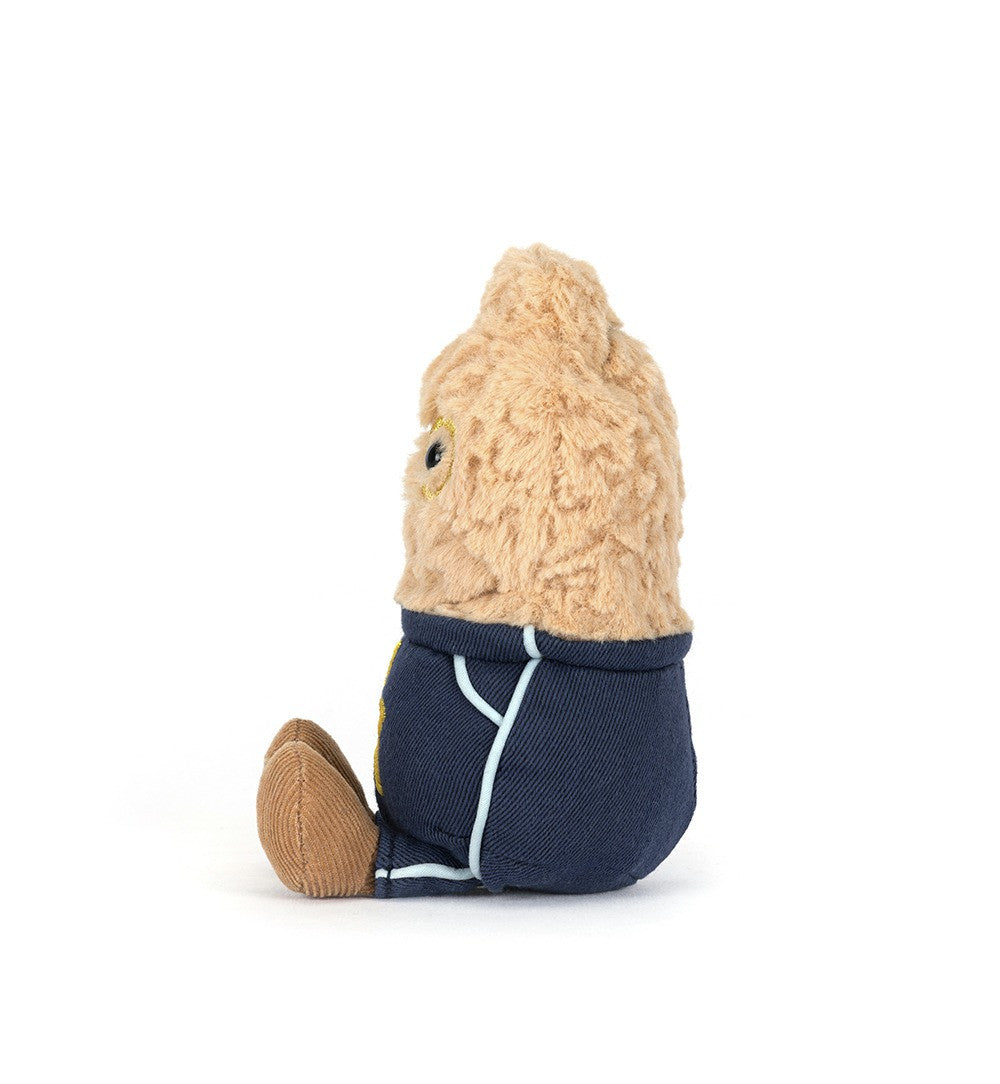 Small plush toy with a beige head and navy body on a white background