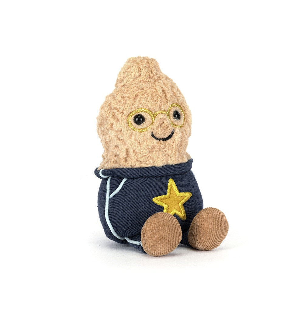 A plush toy shaped like a smiling beige character wearing round glasses, a navy blue outfit, and a yellow star patch, photographed on a clean white background.