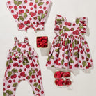 Children's clothing set with raspberry pattern on a white background