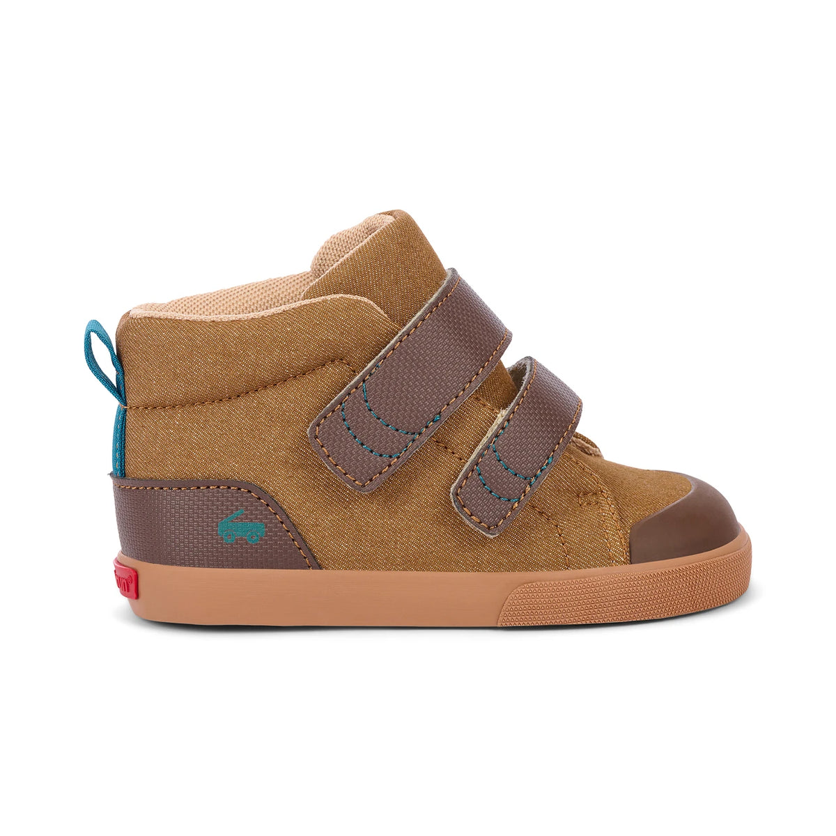 A toddler's high-top sneaker in tan canvas and brown leather, featuring two brown hook-and-loop straps with blue stitching, a gum sole, and a small turquoise pull tab.