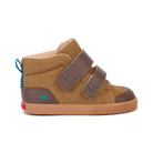 A toddler's high-top sneaker in tan canvas and brown leather, featuring two brown hook-and-loop straps with blue stitching, a gum sole, and a small turquoise pull tab.