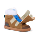 A toddler's high-top sneaker in brown suede and canvas, featuring beige velcro straps, a bright blue ankle strap, a brown leather heel tab, and a gum sole, shown on a white background with its white plastic foot insert visible.