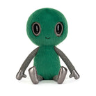 Green alien plush toy with black eyes on a white background