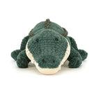 Plush toy alligator on a white background