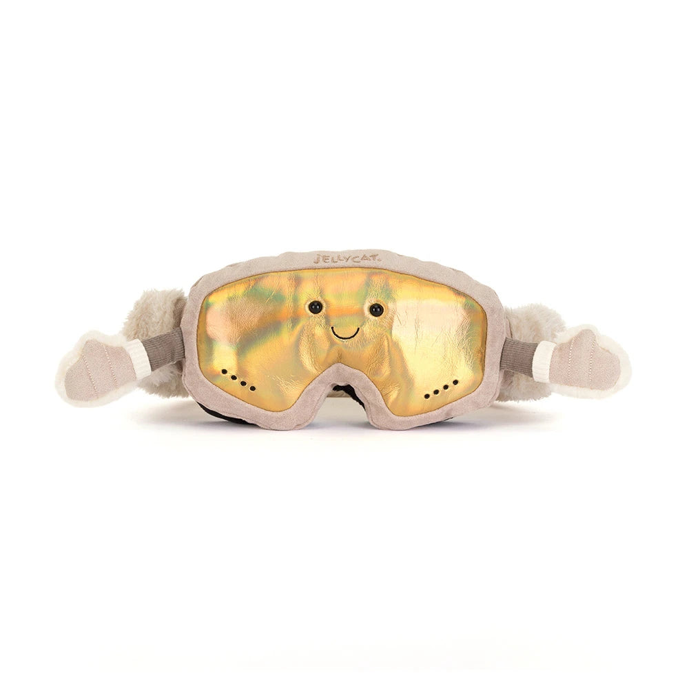 A plush novelty sleep mask shaped like a cat, featuring a shiny gold iridescent lens with a smiling face and gray plush trim and ears.