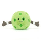 Green plush toy with polka dots and brown arms on a white background
