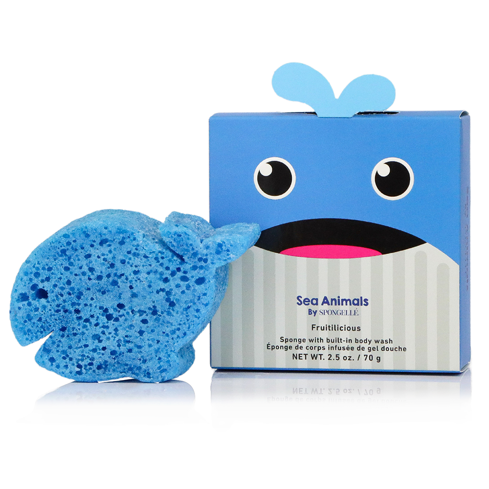 A blue whale-shaped sponge next to its blue retail box with a whale face, labeled 'Sea Animals By Spongify It Fruitilicious' on a white background.
