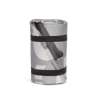 Roll-up mat with gray and white pattern and black straps on a white background
