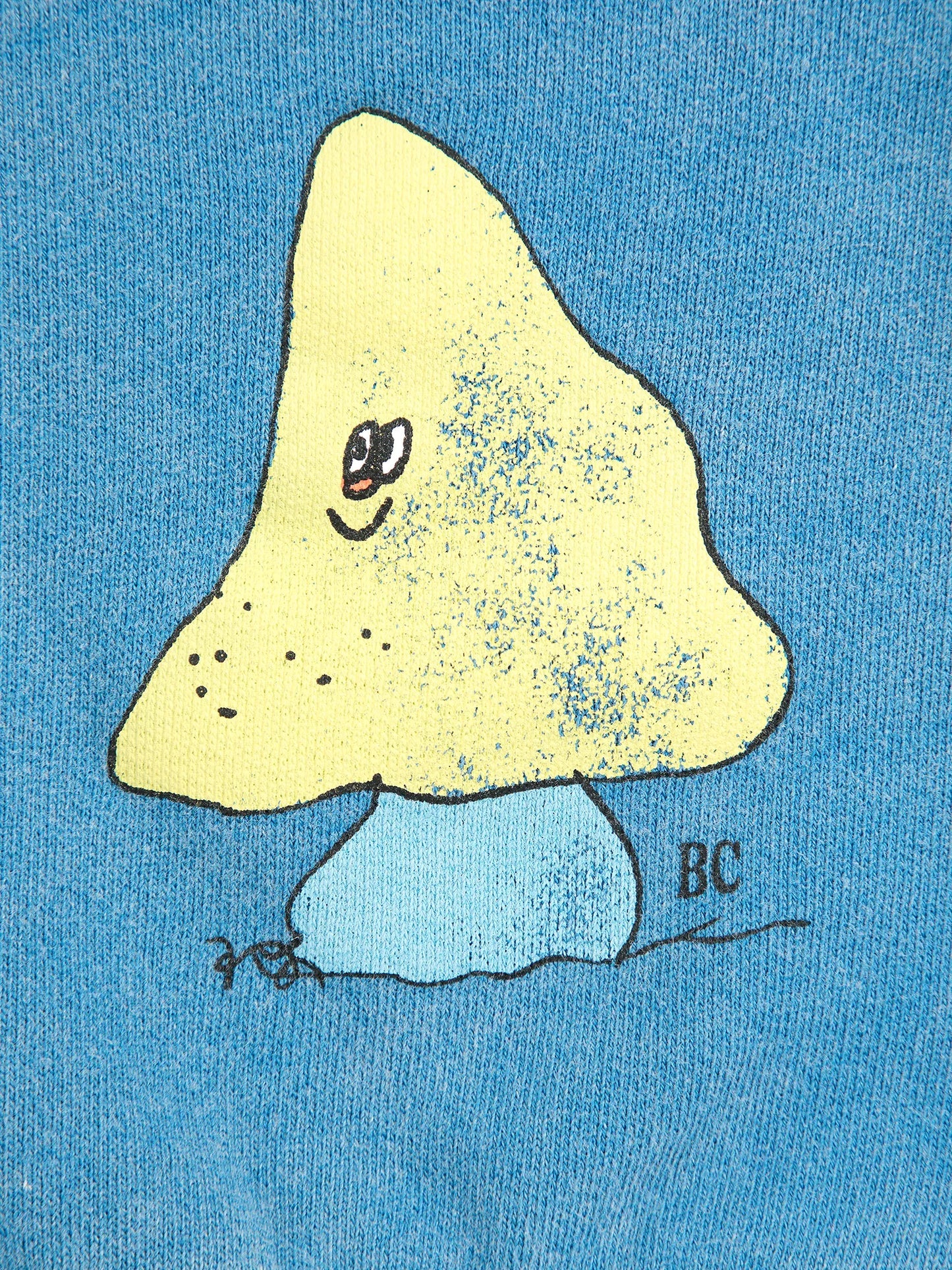 Yellow mushroom with a face on a blue background, signed 'BC'.
