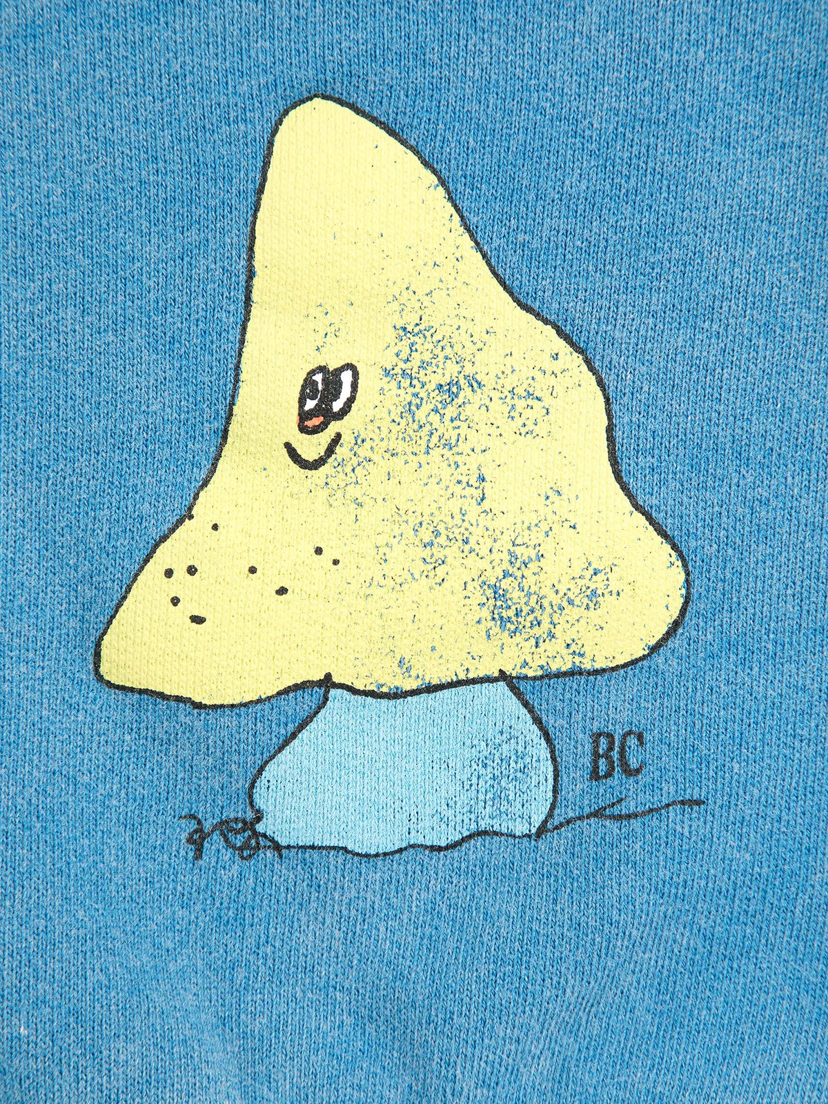 Yellow mushroom with a face on a blue background, signed 'BC'.