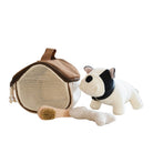 A toy puppy with a collar, a brush, and a chew bone next to a small pet house, all in beige and white colors.
