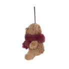 A plush Christmas stocking ornament shaped like a teddy bear wearing a burgundy faux-fur scarf, hanging by a thin black string against a plain white background.