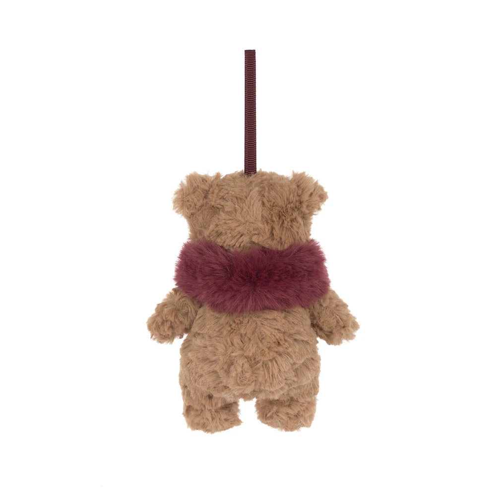 A plush Christmas stocking ornament shaped like a teddy bear wearing a burgundy faux-fur scarf, hanging by a thin black string against a plain white background.