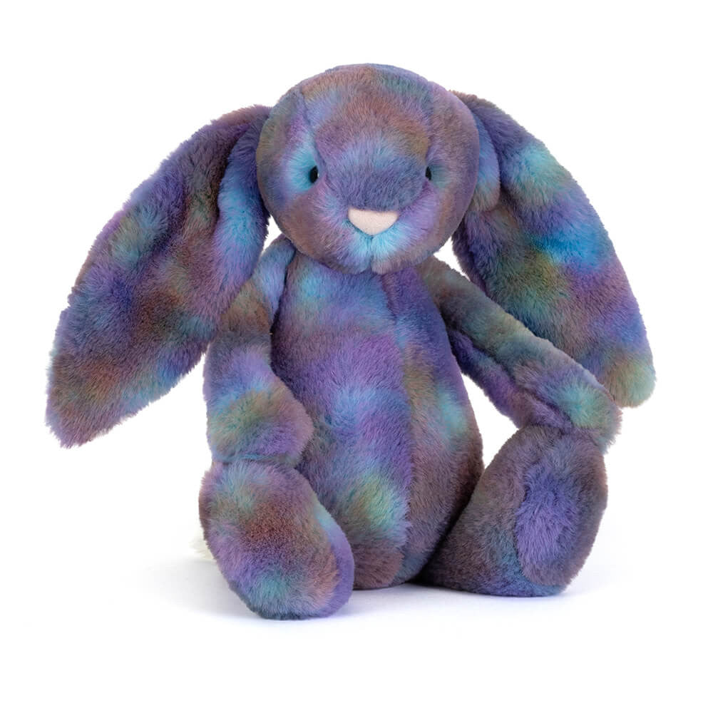 A plush stuffed bunny with long floppy ears, made from fuzzy fabric in a mottled pastel blend of purple, blue, and green, sitting against a plain white background.