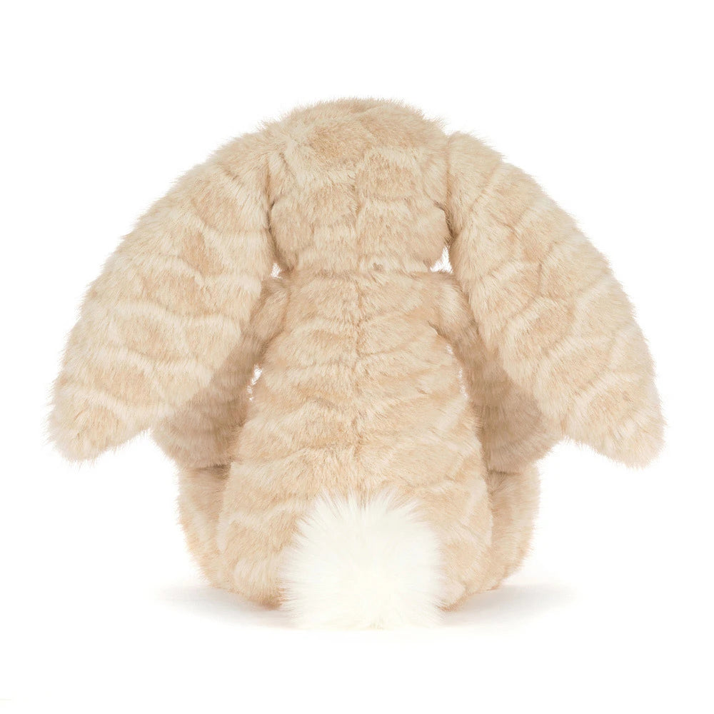 A plush stuffed bunny in a light beige faux fur material with a contrasting white fluffy tail, shown from the back on a white background.