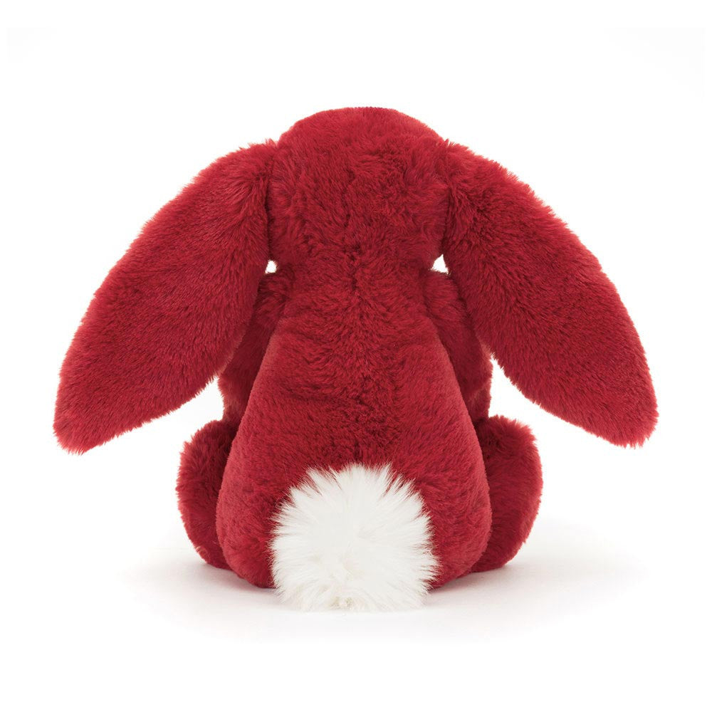 Red plush bunny toy on a white background