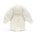 White plush bunny toy on a white background