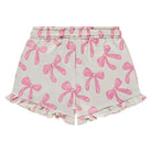 Shorts with pink bow pattern on a white background