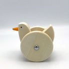 Wooden toy duck on a white background