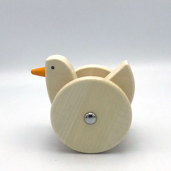 Wooden toy duck on a white background