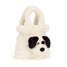 A plush white dog-shaped handbag with black ears, black eyes, and a black nose, photographed on a clean white background.