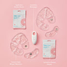 Frida Mom breast care products including masks, massage device, and warmers on a pink background