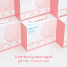 Frida Mom breast care kit packaging on a white background with pink accents.