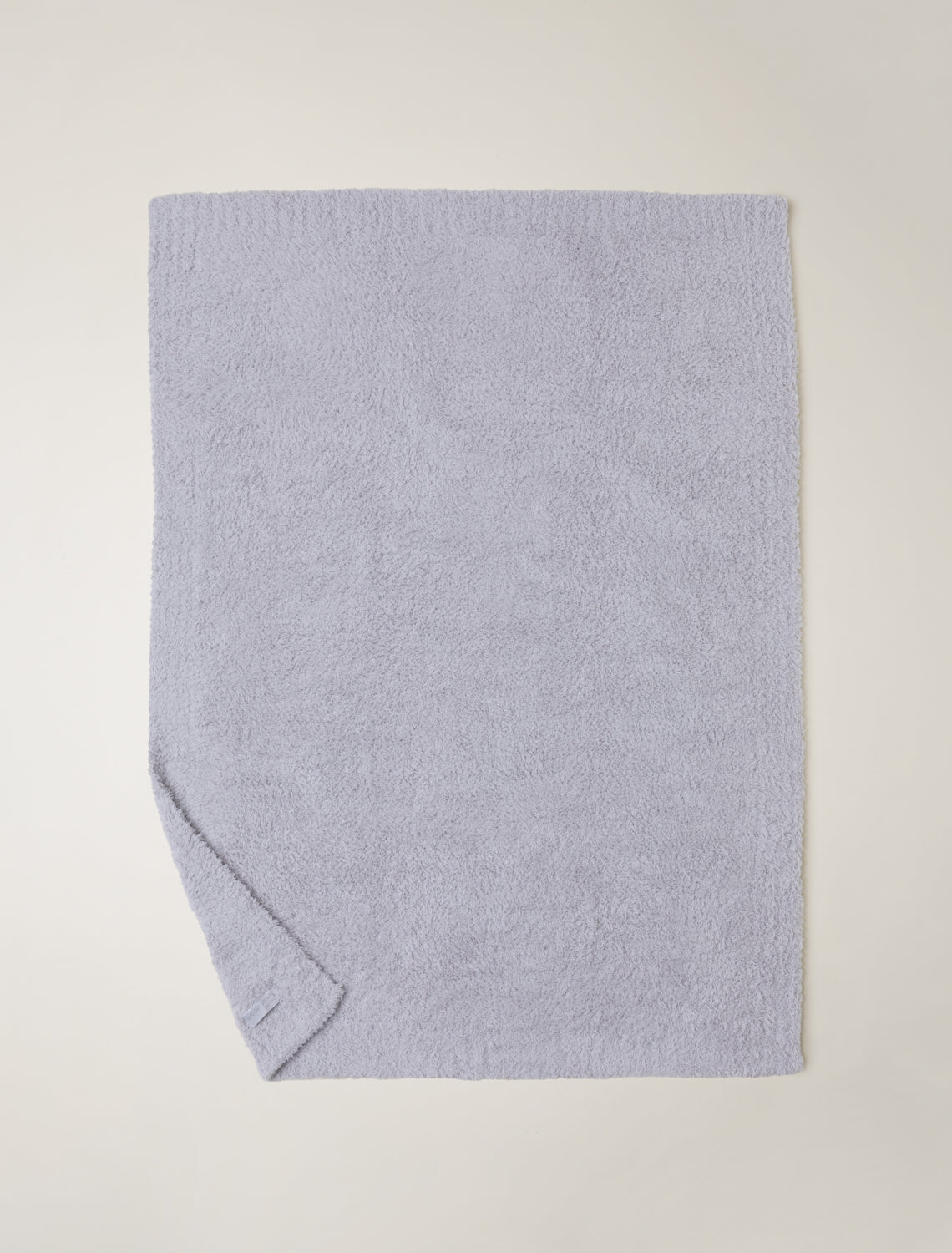 Light blue towel on a light gray background
