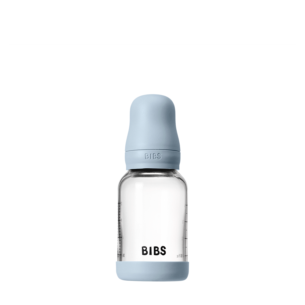 BIBS baby bottle with light blue cap and base on a white background