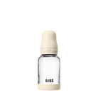 Clear glass baby bottle with beige cap and 'BIBS' branding on a white background